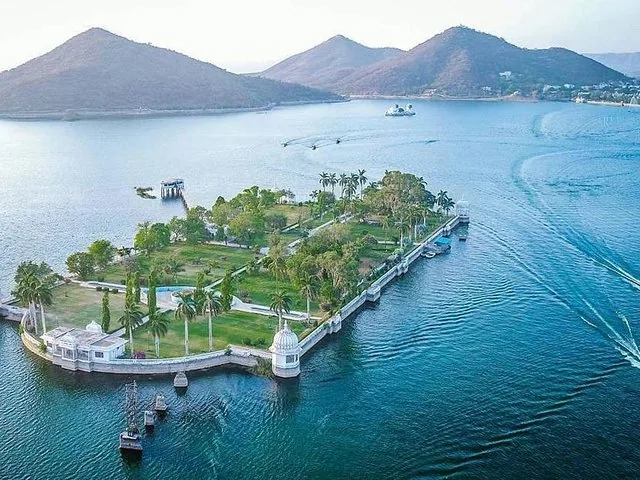 An aerial view of Jagmandir Island Palace in the middle of a lake.